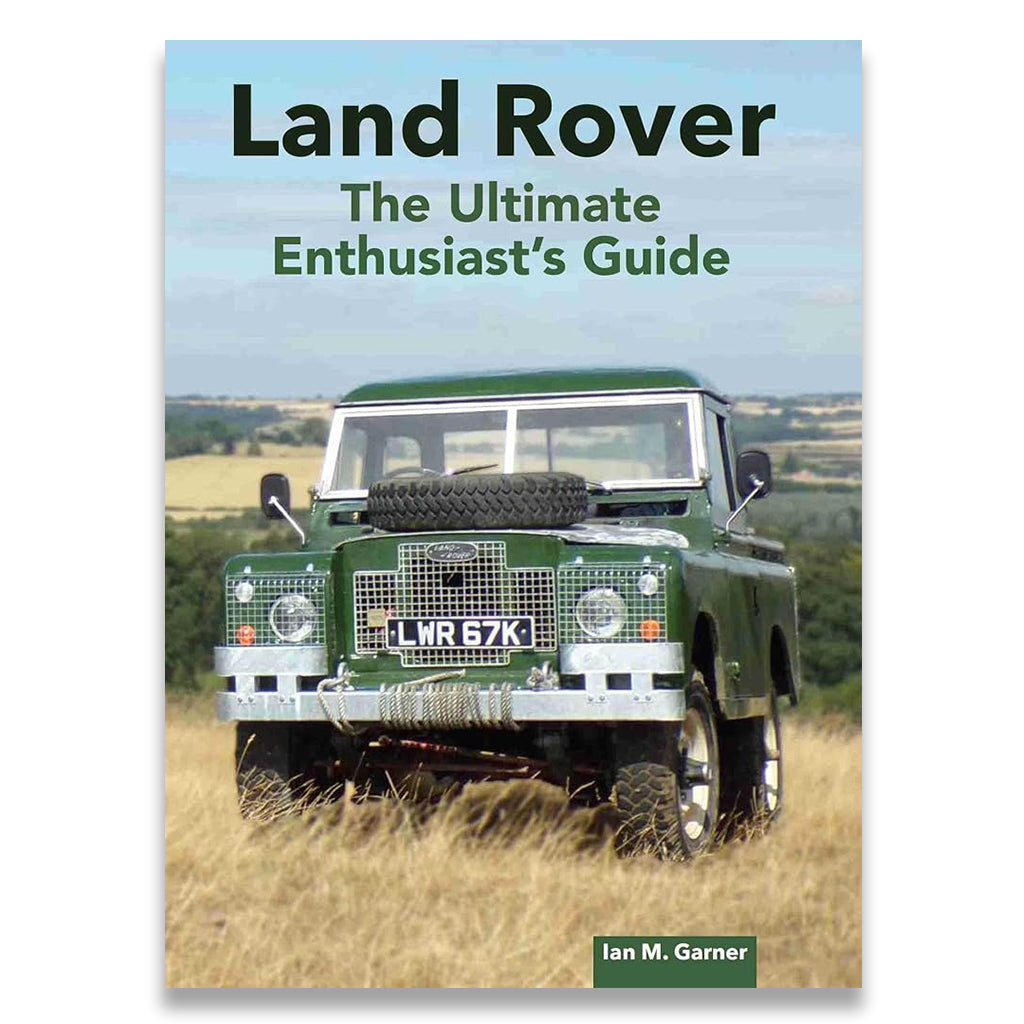 Book cover for 'Land Rover: The Ultimate Enthusiast's Guide' by Ian M. Garner, featuring a vintage green Land Rover in a grassy field under a blue sky.
