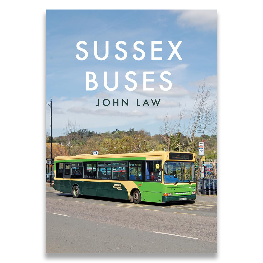 Book cover of 'Sussex Buses' by John Law with a green and yellow bus on a road.
