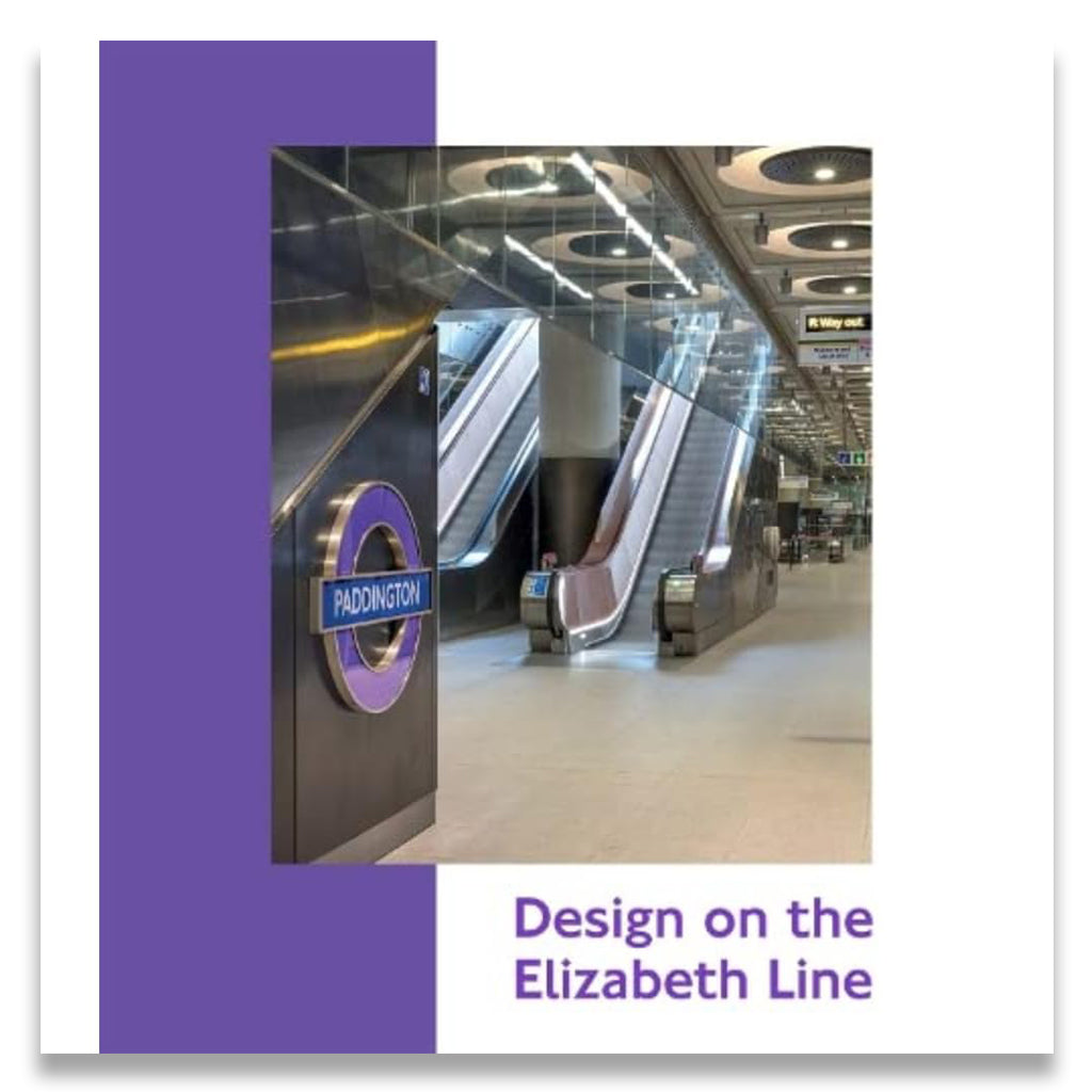 Modern subway station with escalators and 'Paddington' sign, featuring purple accents.