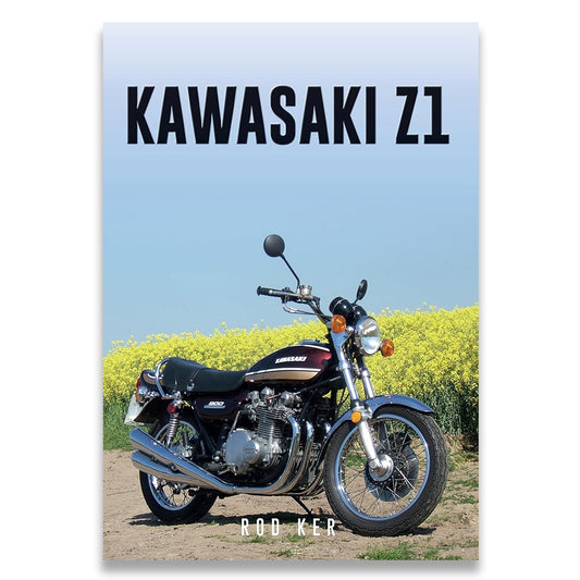 Book cover of 'Kawasaki Z1' with a motorcycle on a dirt road and yellow flowers.