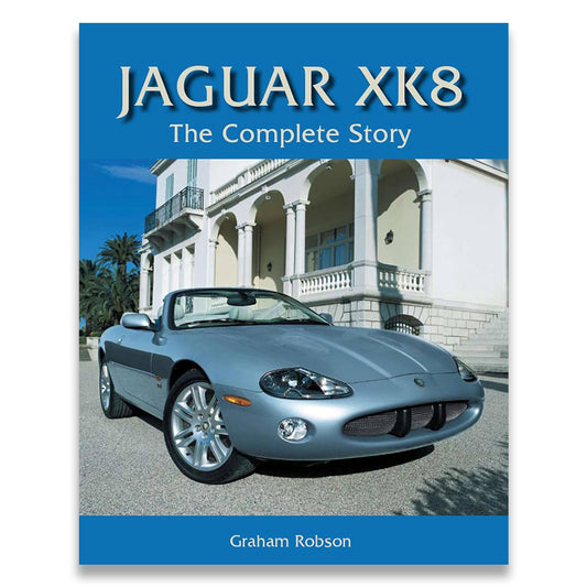 Book cover for 'Jaguar XK8: The Complete Story' by Graham Robson, featuring a silver convertible Jaguar XK8 parked in front of a grand white villa under a blue sky.