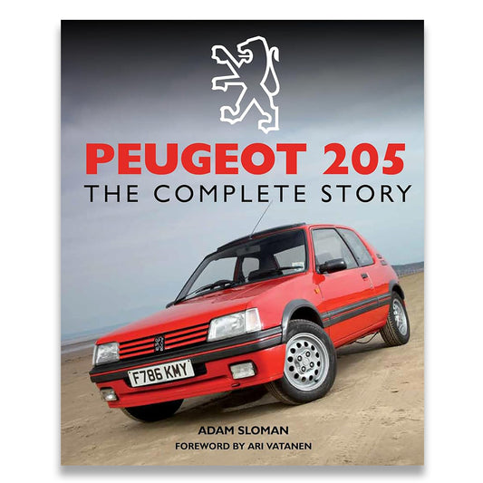 Book cover for 'Peugeot 205: The Complete Story' by Adam Sloman, featuring a red Peugeot 205 car on a beach with the Peugeot lion logo and title text.